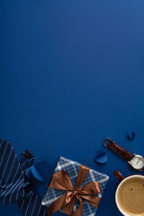 Fototapeta premium Blue Father's Day vertical flatlay with wrapped gift, tie, watch, coffee and brown ribbon bow