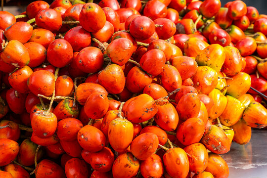 A vibrant display of chontaduros palm fruit in a traditional Colombian market - Bactris gasipaes