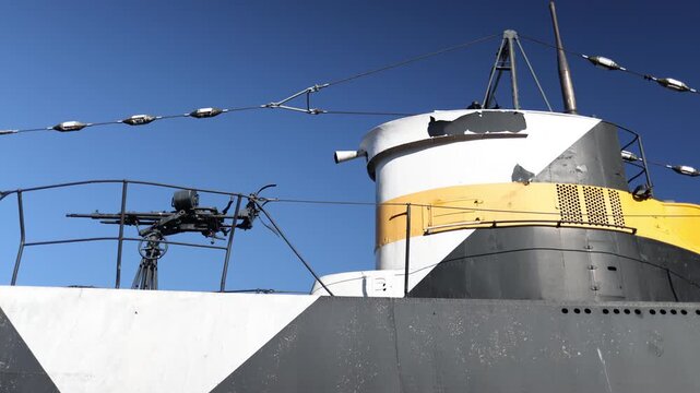 Military submarine surface section with mounted weapon above water dramatic naval atmosphere realistic maritime defense scene cinematic ocean footage during daylight