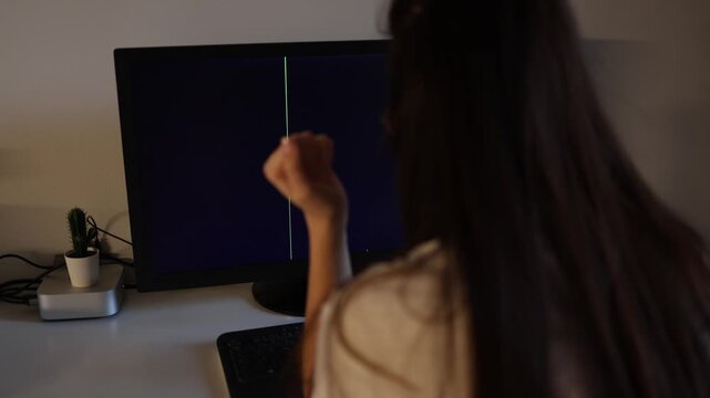 Frustrated brunette woman looking at broken computer display with black striped screen modern technology malfunction remote office atmosphere cinematic indoor footage
