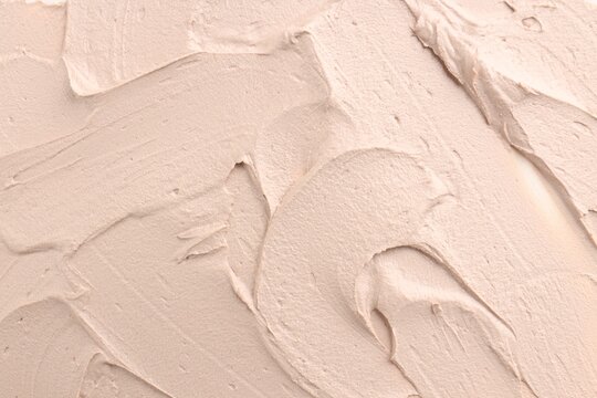 Natural clay paste for facial and body care as background, top view. Mud therapy