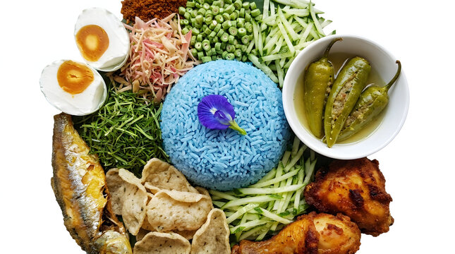 Traditional Malaysian blue rice Nasi Kerabu with assorted herbs and side dishes, isolated on white