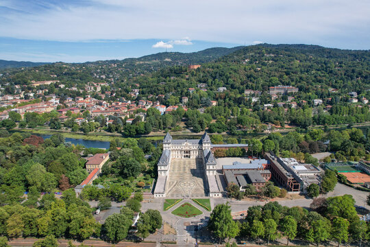 Aerial view of Castello del Valentino with its grand courtyard and lush greenery along the Po river Torino, Piemonte, Italy.