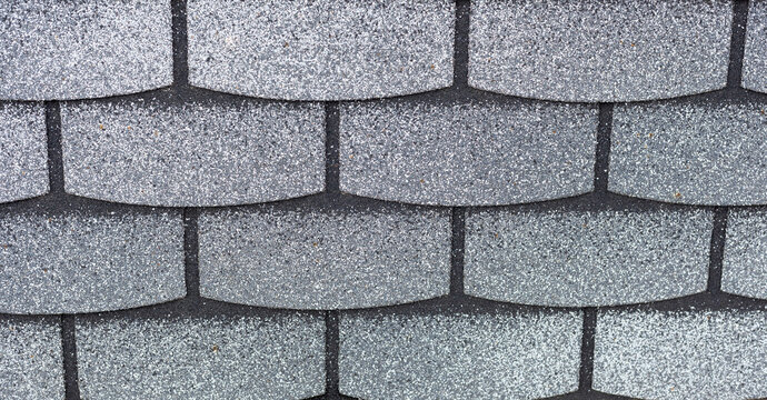 Close-up texture of multi-colored facing facade tiles with sand