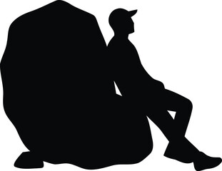 Hiker resting against a large boulder silhouette © MDZAHID