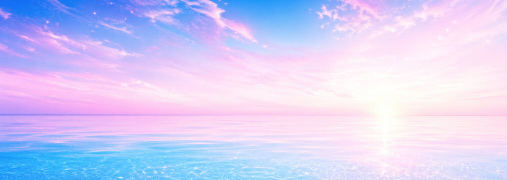 淡い朝焼けに輝く海と空の風景