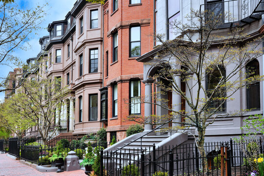 Elegant row of well preserved old townhouses on an urban street