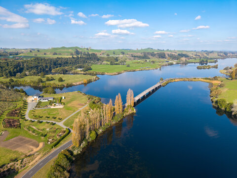 Lake Karapiro in New Zealand's Waikato region. The Maungatautari Road Bridge crosses the lake at its eastern end. Aerial view, autumn