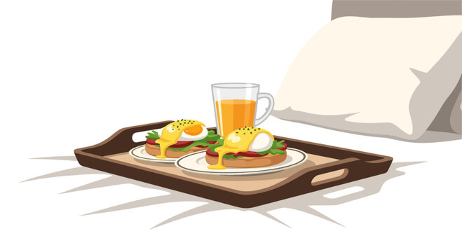 Luxury breakfast in bed with eggs benedict and orange juice