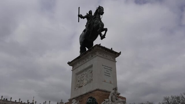 Equestrian statue of Philip IV in Plaza de Oriente Madrid Comunidad de Madrid Spain faces Palacio Real with baroque sculpture by Pietro Tacca and base by Mart&iacute;nez Monta&ntilde;&eacute;s, panning down