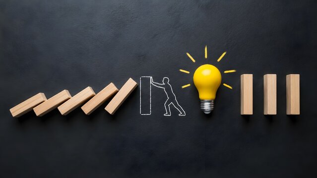 Chalk drawn figure stopping falling domino blocks leading to a bright yellow lightbulb representing risk management intervention and innovative problem solving