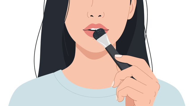 Woman applying makeup with a brush on her lips, close-up shot