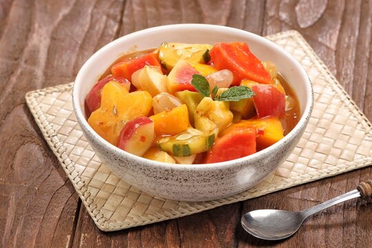 Rujak kweni or rujak aceh is a type of typical Acehnese rujak made from mashed kweni mango with chili, sugar, salt and tamarind juice.
