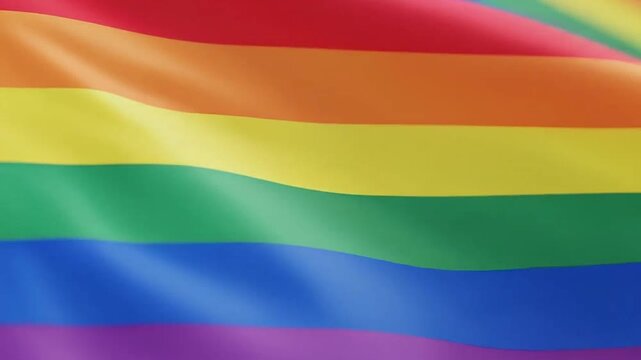 A vibrant multicolored flag waves gently in the soft natural light