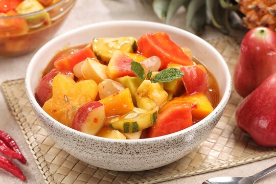 Rujak kweni or rujak aceh is a type of typical Acehnese rujak made from mashed kweni mango with chili, sugar, salt and tamarind juice.
