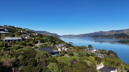 Fototapeta premium Aerial View of Coastal Houses Overlooking Akaroa Bay in New Zealand