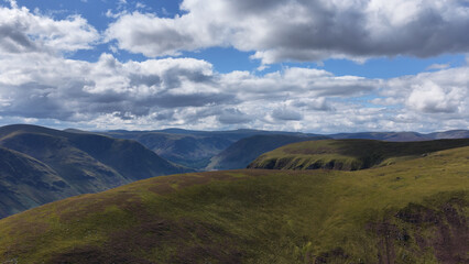 Obraz premium Aerial View of Green Mountain Ridges in the Scottish Highlands