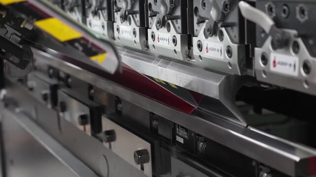 CNC press brake machine bending painted metal panel with AGRIP-M hydraulic clamps for appliance casing