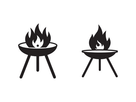 Two black barbecue grills with flames on top  cooking  outdoor  fire  grill