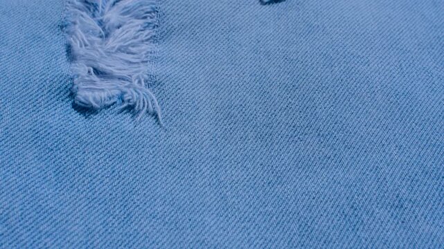 Detailed denim close-up, revealing the indigo blue texture and stitching, perfect for fashion and design projects.