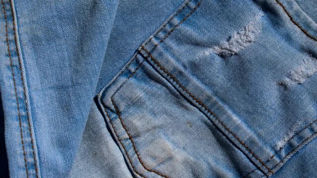 Exquisite stitching detail on denim, capturing the craftsmanship and unique texture of the fabric.