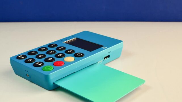 Mini blue card machine on a flawless surface, perfect for hassle-free transactions. The mini blue card machine rests elegantly on a smooth surface, promoting streamlined transactions.