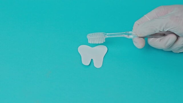 Stop Motion Educational Flat Lay Video Comparing Dental Hygiene Steps On Stained Yellow And Clean White Paper Tooth Silhouettes With Toothbrush