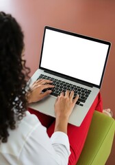 Fototapeta premium Young Woman Working on Laptop with Blank White Screen Mockup, Over the Shoulder View of Ha