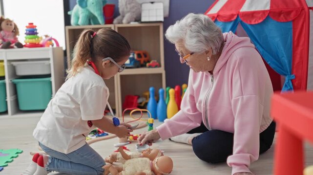 Woman uses toy stethoscope to examine a doll while child kneels and hands a toy, in a playroom building; intergenerational care.