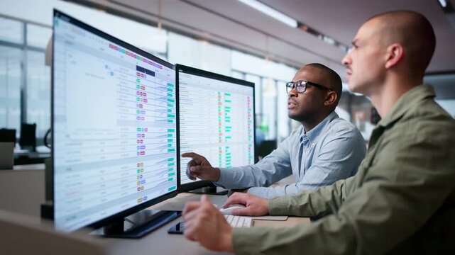 Medical Billing Analyst Reviews Data Codes On Computer