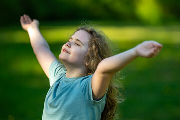 Fototapeta premium Kid open arms support healthy childhood. Kid open arms celebrate playful nature. Happy kid open arms create smiles. Summer kid open arms feel carefree.