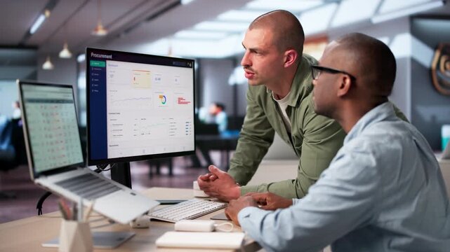 Procurement Manager And Colleague Review Software Platform