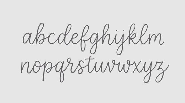 A handwritten alphabet in lowercase dark grey cursive script displayed on a plain white paper background