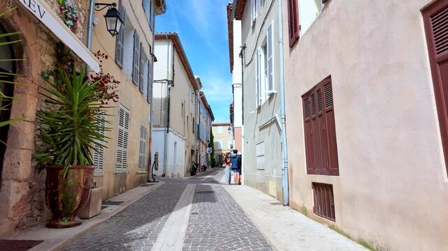 Narrow Cobblestone Street with Potted Plants in Cassis France