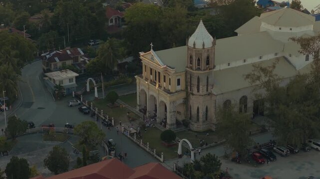 Aerial orbit around Dauis Church in coastal town of Bohol