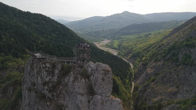 Drone orbit shot of tourists on the wooden spiral observation deck at Valla Canyon, Kastamonu, Turkey.