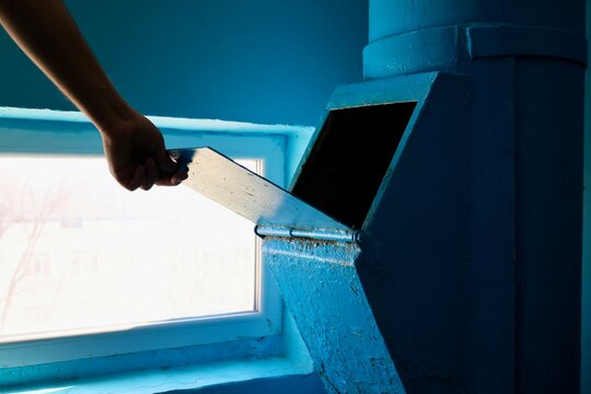 A garbage chute in an old building. The stairwell walls are blue, like the fresh paint of an old nine-story building.High quality 4k footage