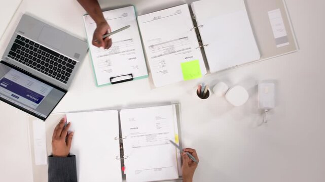 Accountants Reviewing Tax Documents During Important Finance