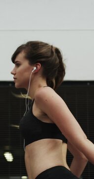 Face, music and stretching with runner in city for streaming service, health podcast and ready. Start, exercise playlist and earphones with person outdoor for fitness, training and smart watch