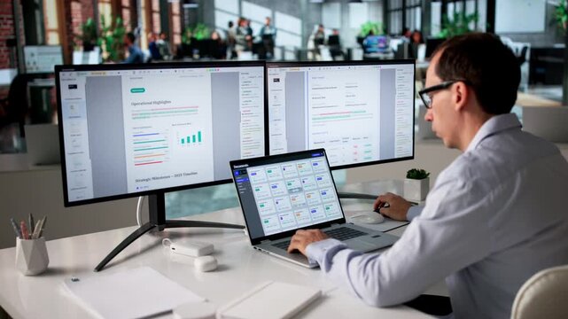 Office Manager Organizing Files On Computer