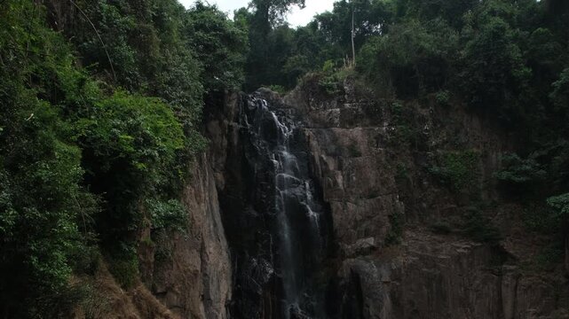 Low flow volume from the Haew Narok waterfall in the dry season. Rain forest at Khao Yai National Park in Thailand.