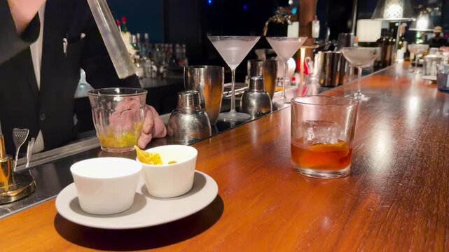 Professional Japanese Bartender Muddling Ingredients for a Cocktail in Kanazawa
