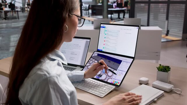 Event Planner Works Diligently On Laptop Organizing Tables