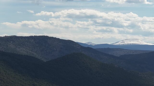 Aerial of Ashley National Forest and snow capped Uinta Mountains in northeast Utah in spring