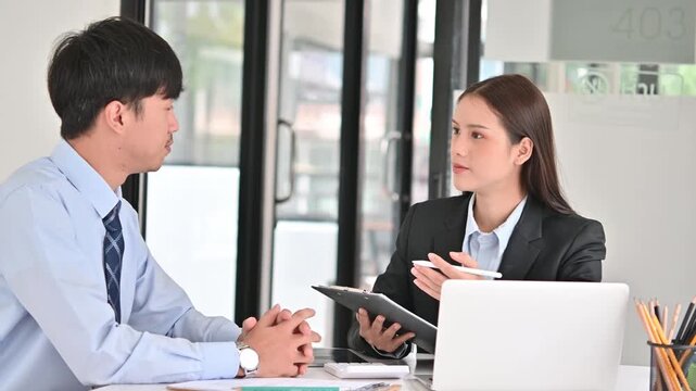 Female HR Manager Interview Male Candidate For Job Recruitment In Modern Office