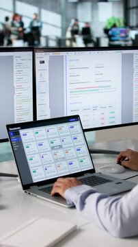 Office Manager Organizing Files On Computer