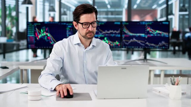 Financial Trader Studies Market Data Intently