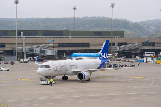 SAS passenger airplane type Airbus A320neo registration SE-RZX pushback at Swiss Z&uuml;rich Airport on an autumn day. Photo taken October 9th, 2025, Zurich Airport, Switzerland.