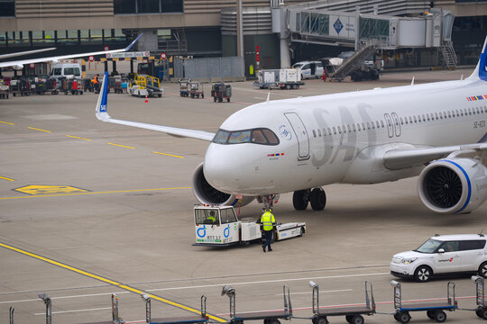 SAS passenger airplane type Airbus A320neo registration SE-RZX pushback at Swiss Z&uuml;rich Airport on an autumn day. Photo taken October 9th, 2025, Zurich Airport, Switzerland.