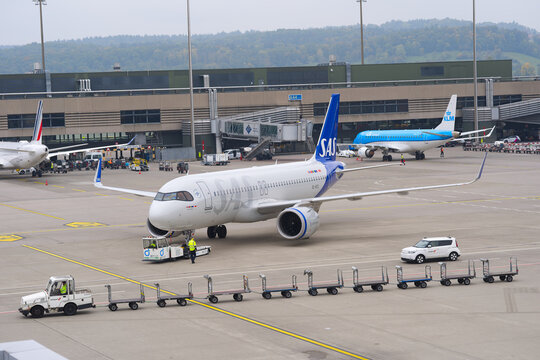 SAS passenger airplane type Airbus A320neo registration SE-RZX pushback at Swiss Z&uuml;rich Airport on an autumn day. Photo taken October 9th, 2025, Zurich Airport, Switzerland.